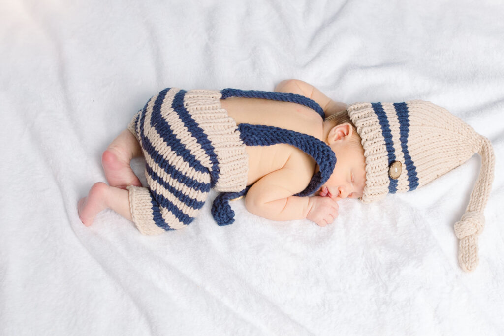 Baby boy sleeping with his bum up in the air during a lifestyle newborn session in Pittsburgh, PA