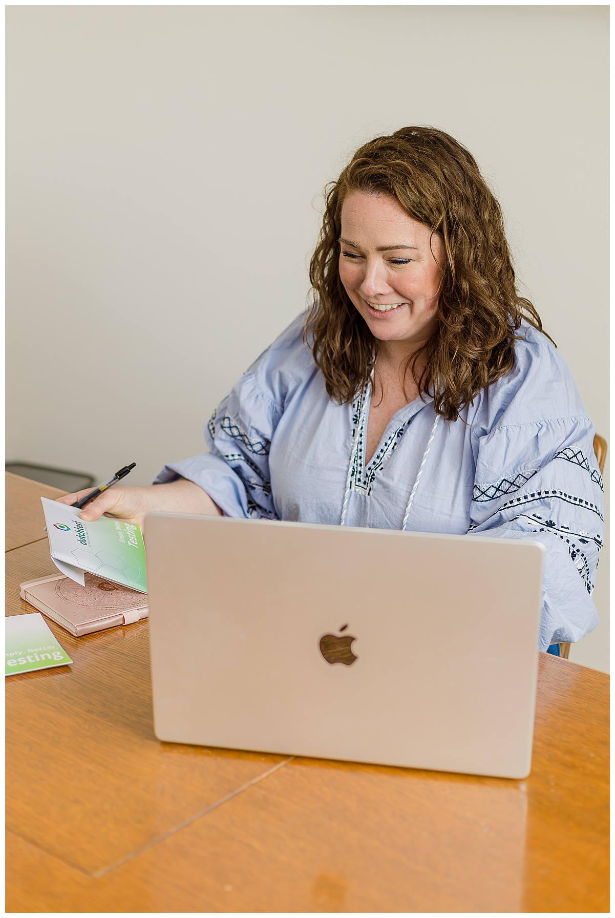 Dr. Kate at Flourish Wellness is looking over functional medicine results. Dr. Kate is a chiropractor in Pittsburgh, PA who can help mom's during their pregnancy and beyond. How chiropractic care can support pregnancy.