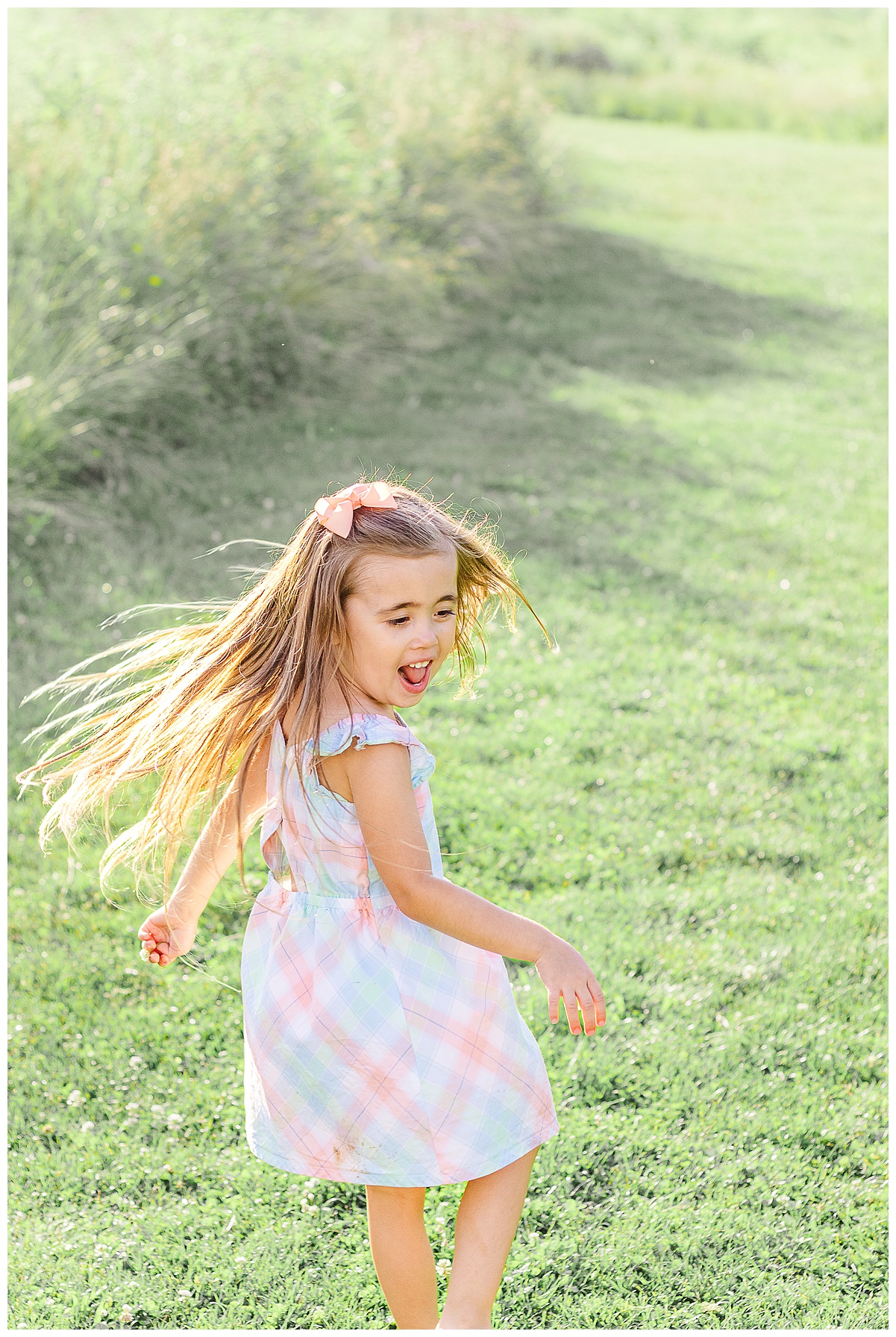 A little girl running around and twirling. A Wexford Family Photographer captured these images. This is an example of a candid shot for What's your family style.