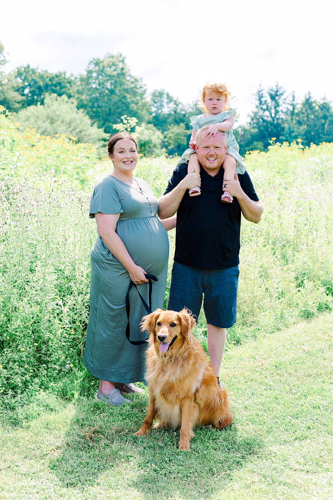 A beautiful family maternity picture with toddler, mom, dad and their sweet dog. Taken during a family session in Pittsburgh.