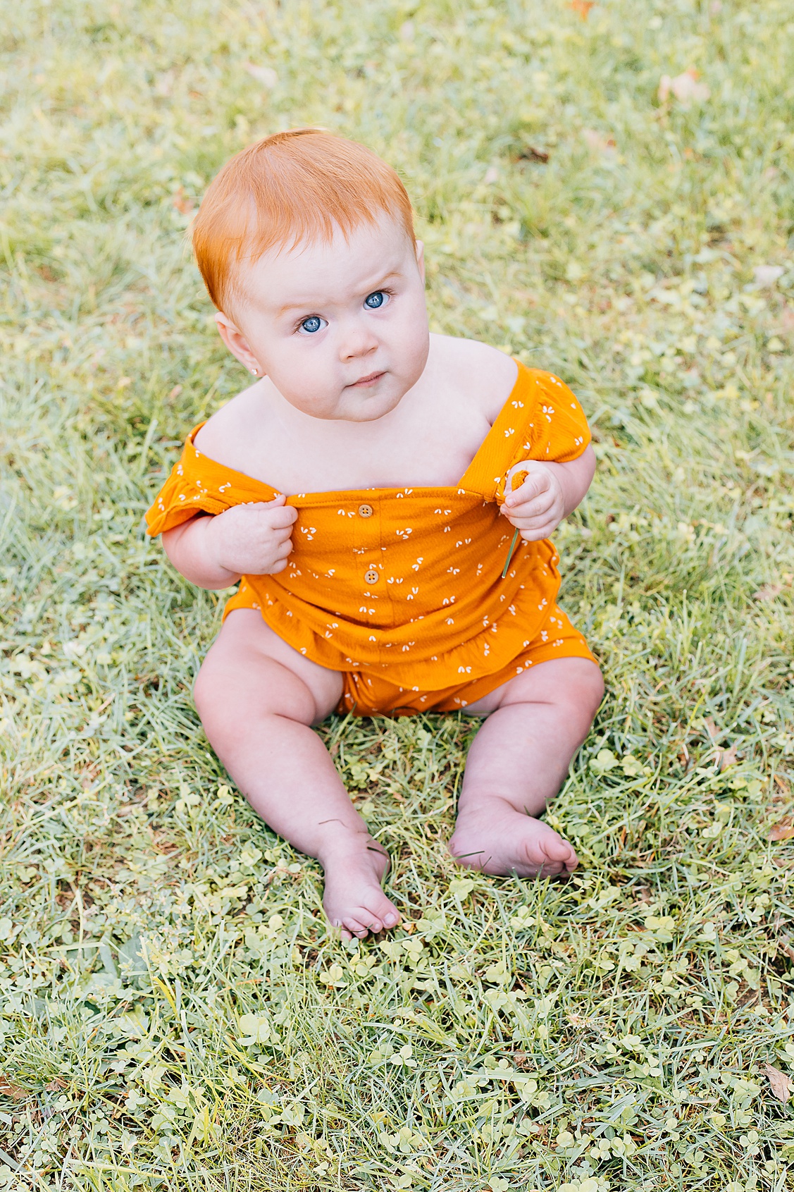 baby girl looking all cute with her big blue eyes during her fall mini session at Hartwood acres in Pittsburgh, PA.