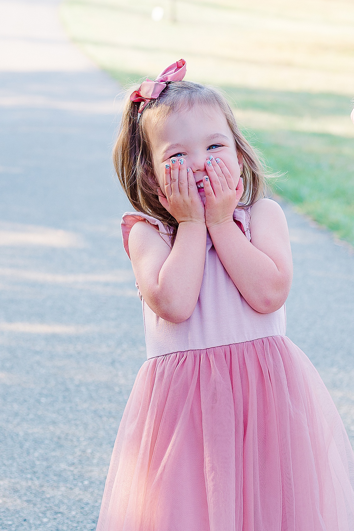 sweet older sister having fun during her family session