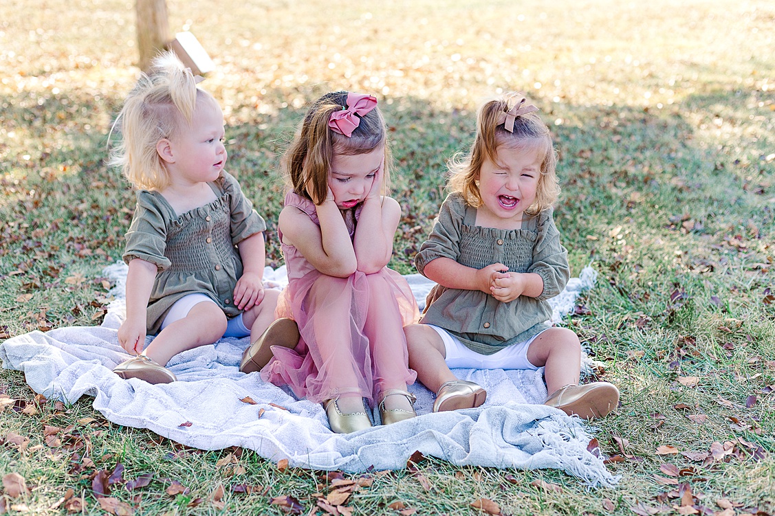 real life....one of the little sisters is crying while the big sister is closing her ears. Crying happens during sessions and that is okay!