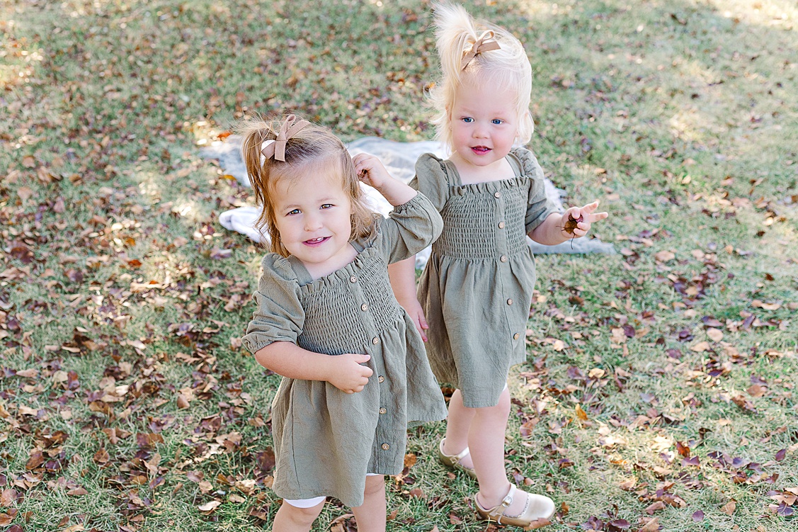 Toddler playing during relaxed Pittsburgh holiday photo session with Shayna VanDamia Photography