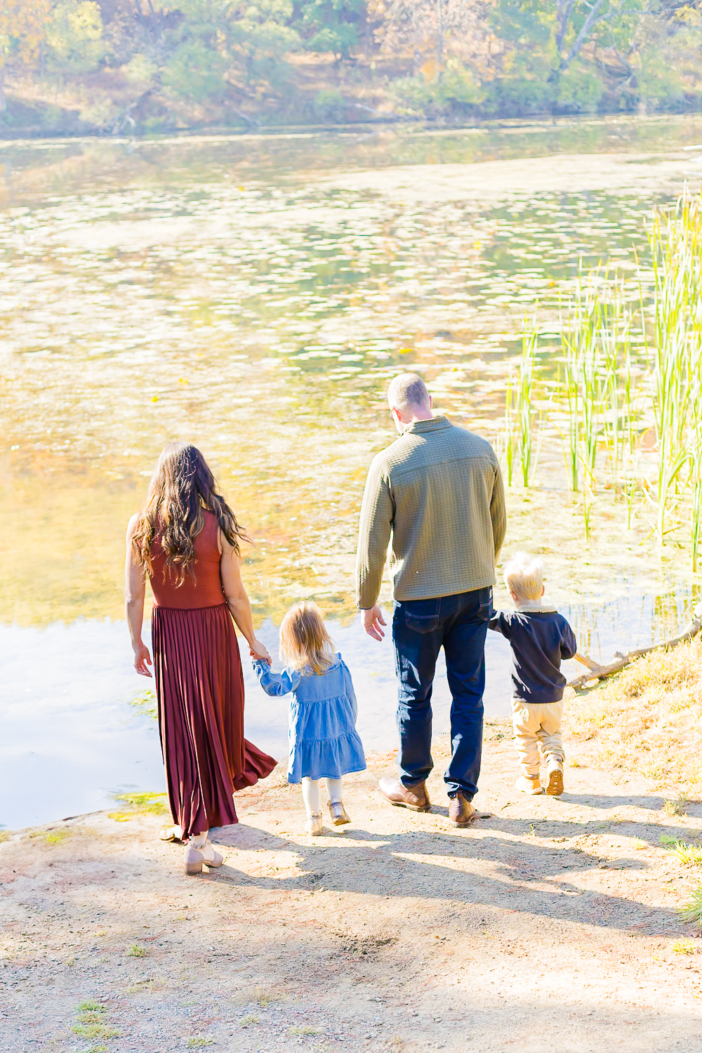 Family looking over the lake at North Park in McCandless during their family session in Pittsburgh.