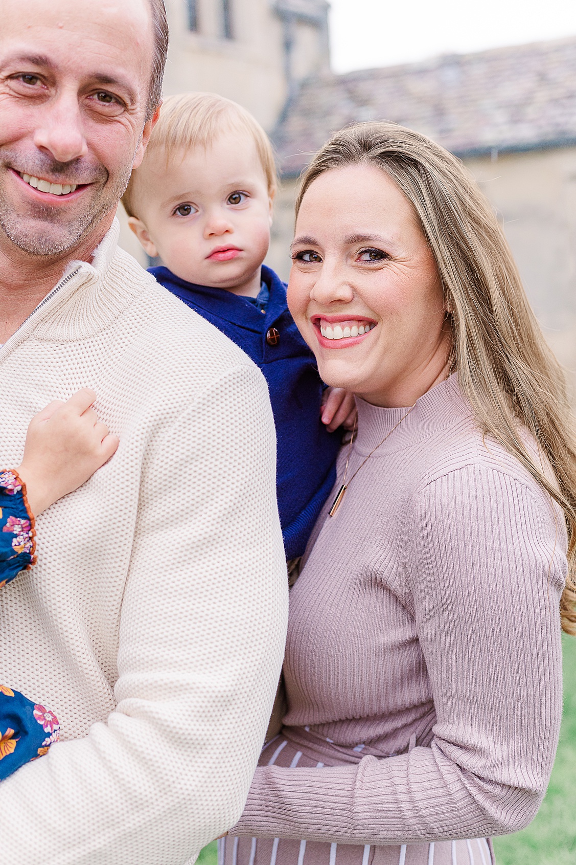 Emotional close-up of mom and dad holding their son at Hartwood Acres in Pittsburgh