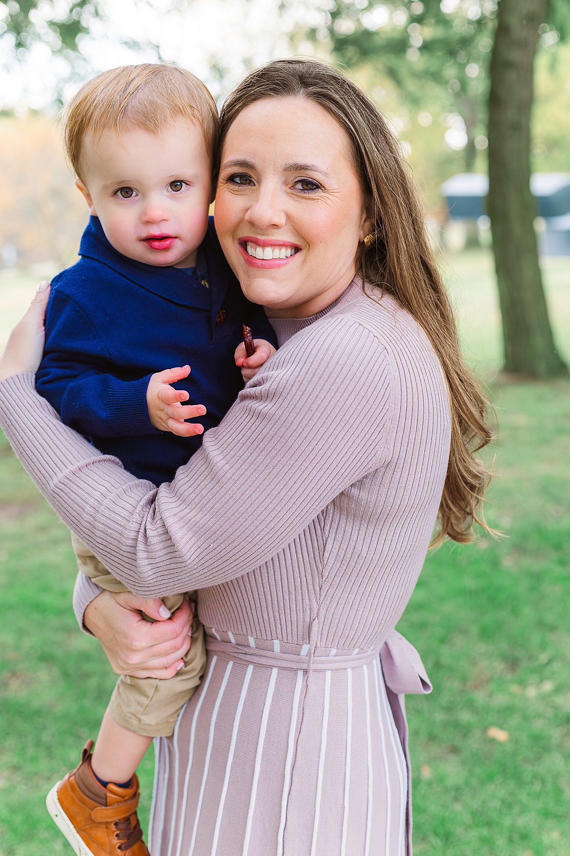 mom is holding her son during their family session at Hartwood Acres which is located in Pittsburgh.