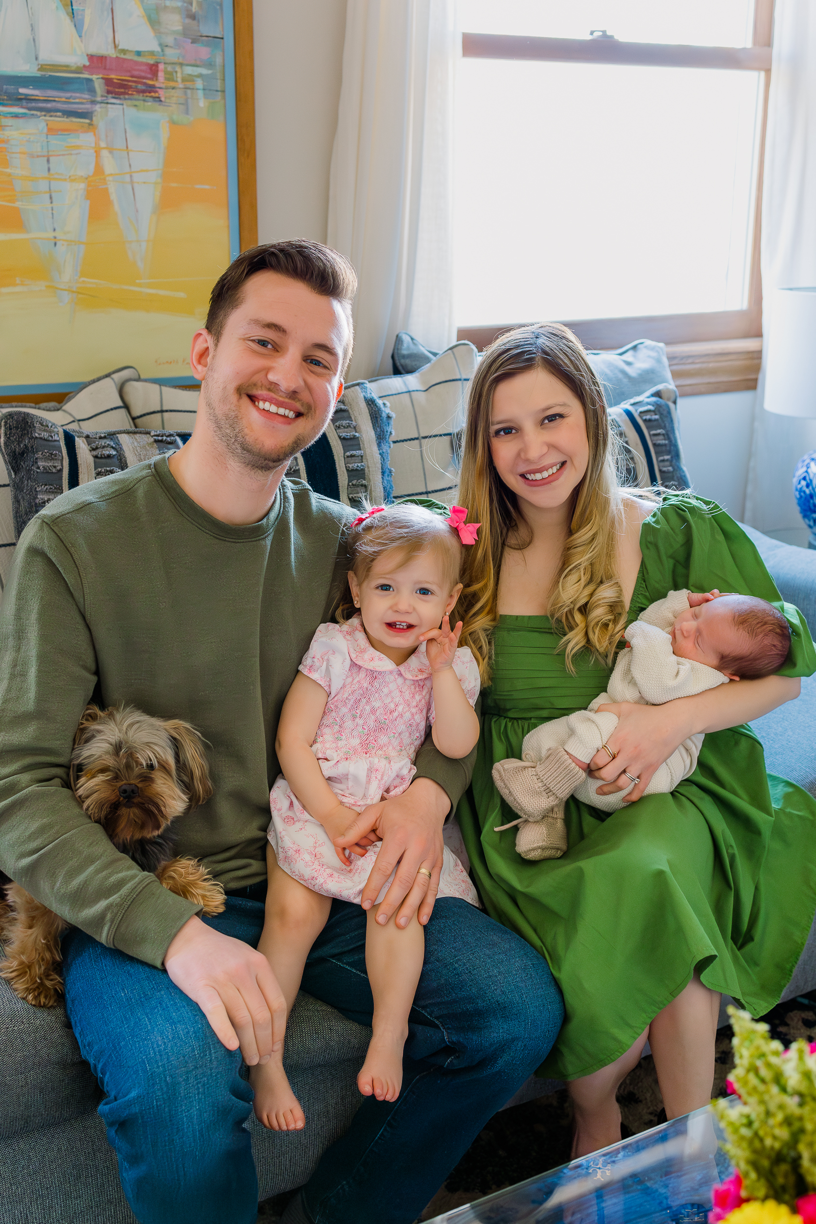 Everyone looking and smiling for the camera even the family dog during an in home newborn session in Wexford PA