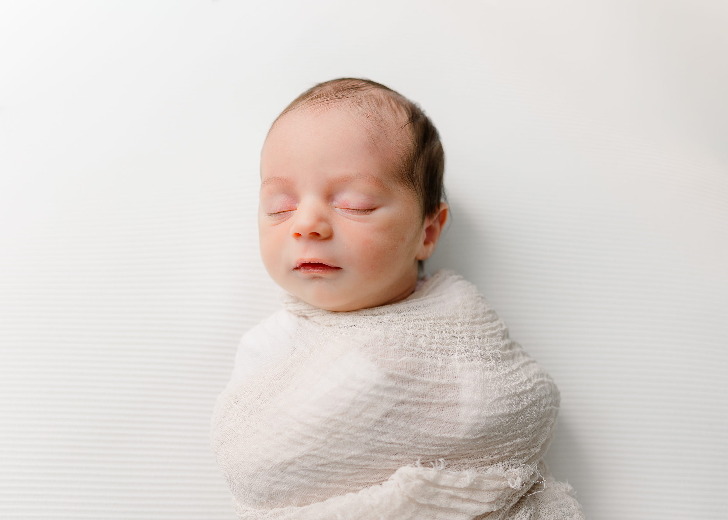 Pittsburgh Newborn Photographer captures a sleepy moment with baby boy.