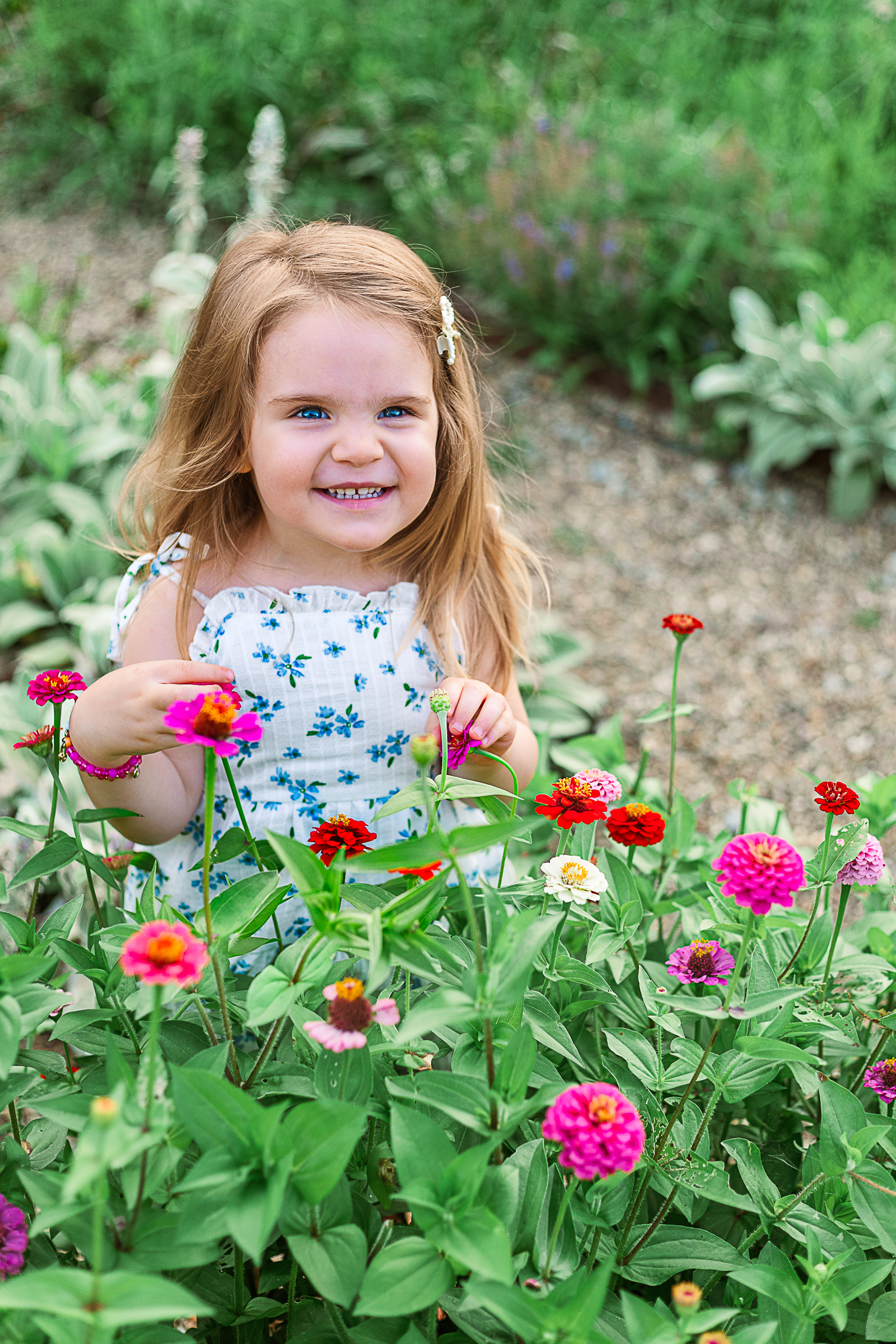 One of my favorite images of the little girl surrounded by flowers during her moms maternity session in Pittsburgh. 