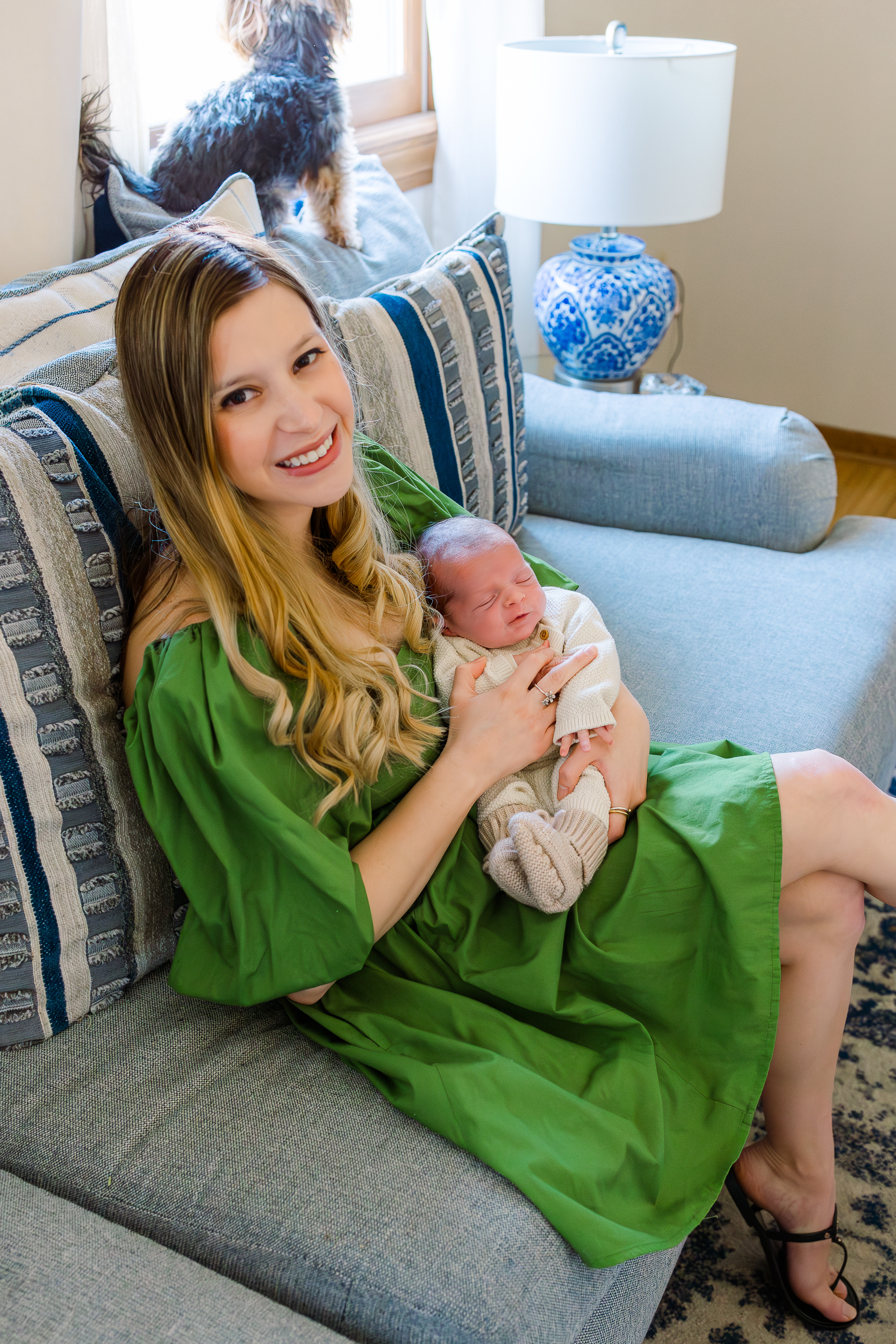 You need to be in the pictures as well.  Mom and baby boy cuddling on the couch during a Pittsburgh Newborn Photo Session In-home.