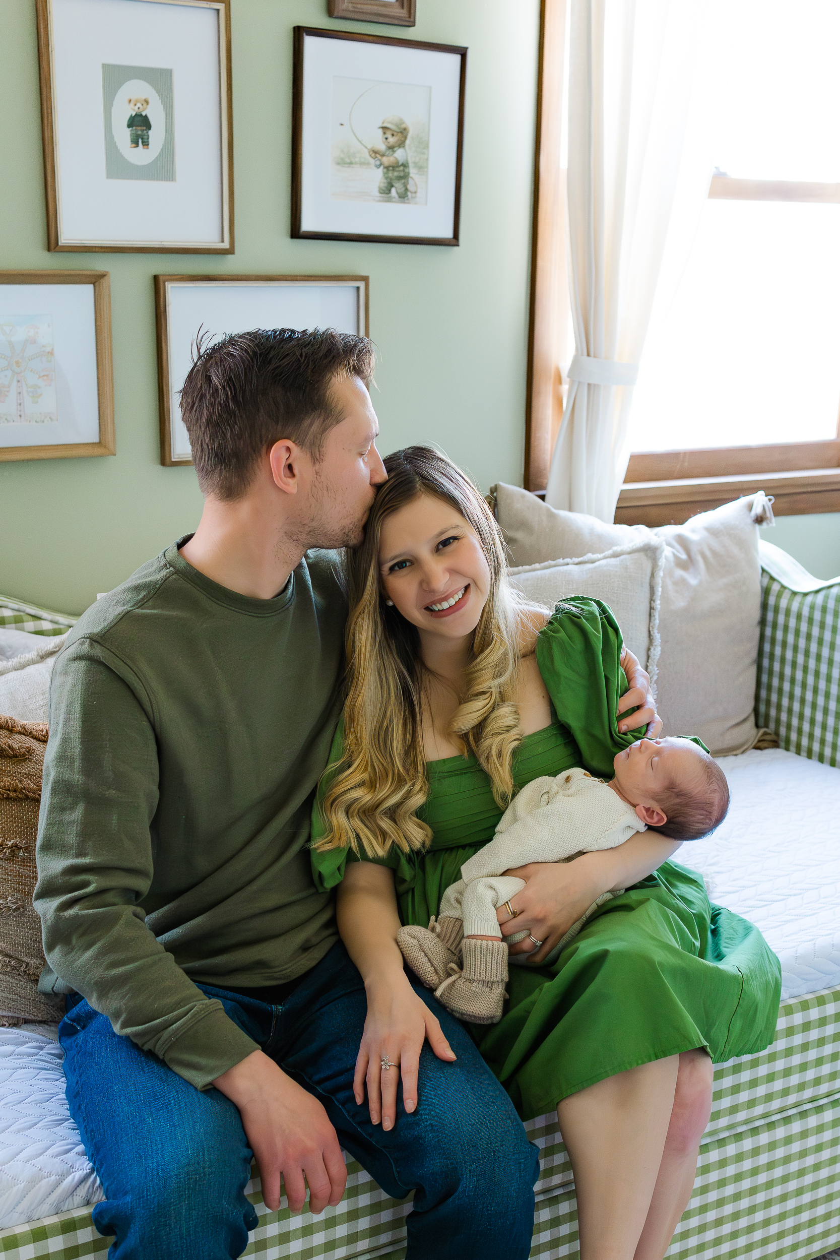 Sweet moment between mom and dad and their baby boy during an in home newborn photo session in Pittsburgh